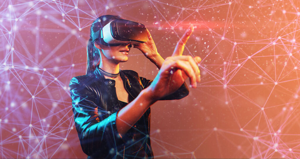 Young girl getting experience VR headset is using augmented reality eyeglasses being in virtual reality. Girl with hands up wearing virtual reality goggles. Woman touching air during VR experience